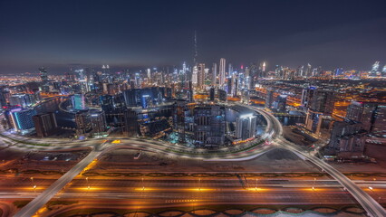 Fototapeta na wymiar Panoramic skyline of Dubai with business bay and downtown district day to night timelapse.