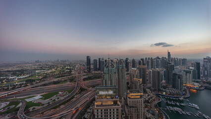 Dubai marina and JLT skyscrapers along Sheikh Zayed Road aerial day to night timelapse.
