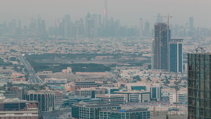 Dubai Downtown skyline row of skyscrapers with tallset tower aerial timelapse. UAE