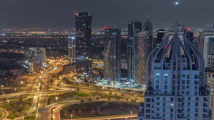 Fototapeta na wymiar Huge highway crossroad junction between JLT district and Dubai Marina all night timelapse.