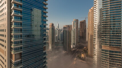 Fototapeta na wymiar Panoramic view of the Dubai Marina and JBR area and the famous Ferris Wheel aerial morning timelapse
