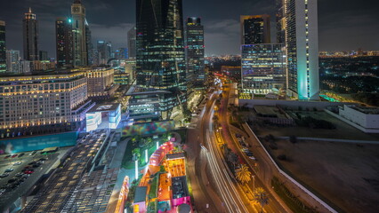 Panorama showing Dubai International Financial district aerial night timelapse. View of business and financial office towers.