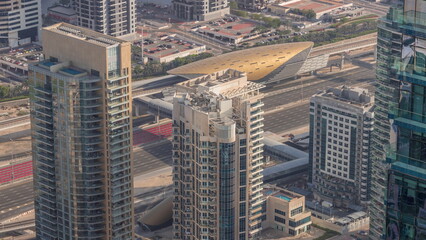 Dubai marina towers with traffic on Sheikh Zayed road near metro station timelapse.
