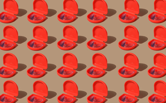 blue mouthguards in red cases