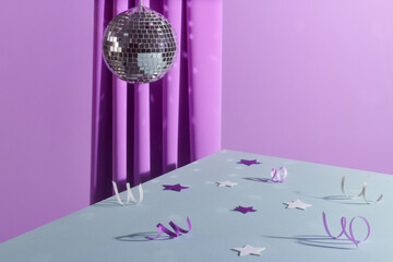 Colourful crystal ball isolated with purple background 