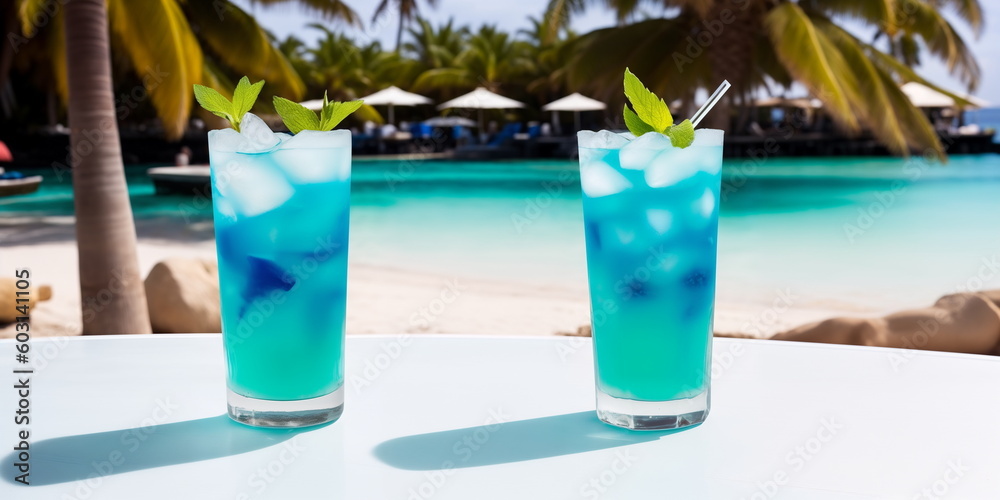 Wall mural a blue cocktail in a glass on a white table against the background of a sea beach on a bright sunny 