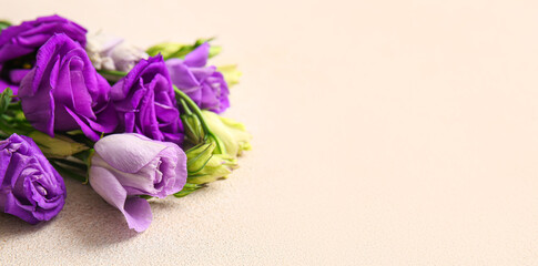 Beautiful eustoma flowers on light background with space for text, closeup