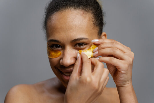 A woman with a patch under her eyes 