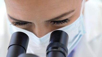 Doctor, covid or scientist woman with microscope in science lab for DNA research, medical and medicine data analysis. Zoom, analytics and nurse for healthcare, cancer innovation or virus test in lab - Powered by Adobe