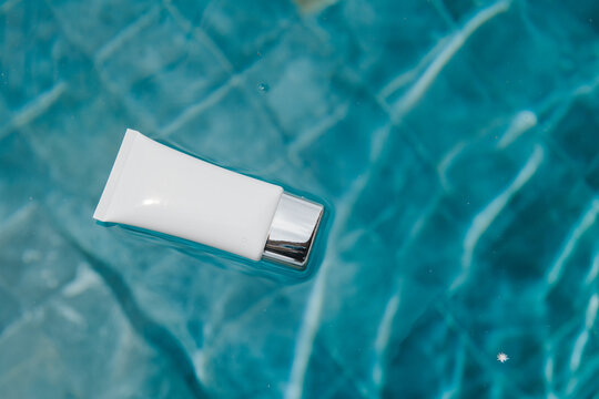 No name blue cosmetic tubein swimming pool