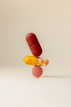 Yellow and red supplement pills