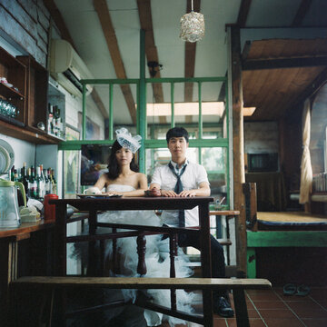 The couple sat solemnly at the table