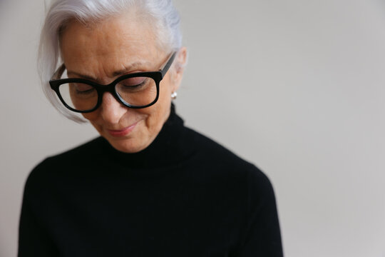Simple portrait of woman on plain background.