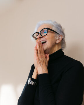 Happy, laughing woman in studio.