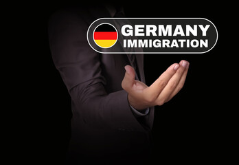 Germany Immigration concept background with man hand and typography along with the flag. Immigration to Germany backdrop