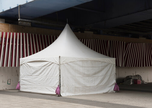 White tent under the blue bridge