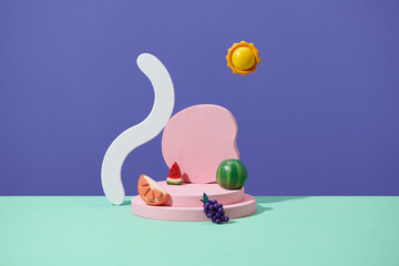 Front view of summer fruit and pink empty podium on purple