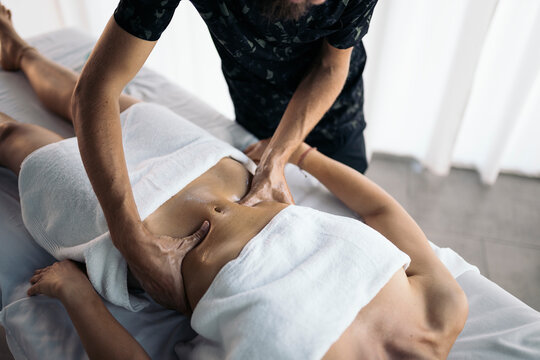 Therapist massaging a patient's stomach