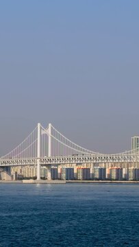 Gwangan Bridge in Busan City , South Korea in day time with sea ship