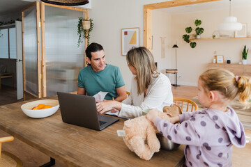 Couple Paying Bill At Home