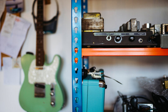 Electric guitar amp details on shelf in repair shop