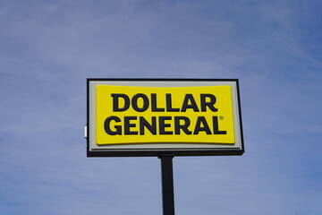 Dollar General signs outside during a sunny day.