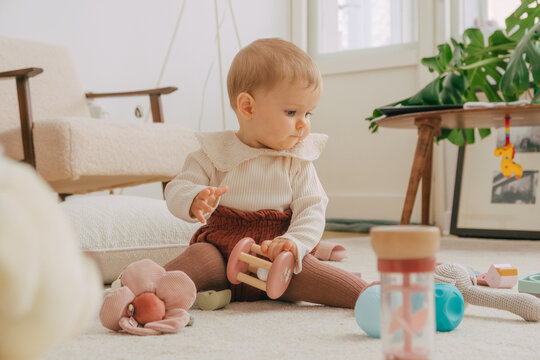 Baby on floor with toys 