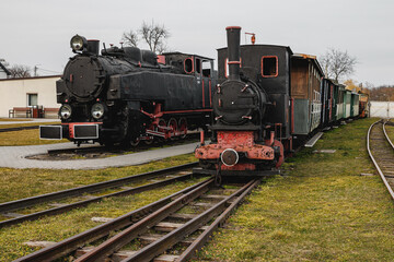 Plakat Vintage locomotive, steam train in an outdoor depot.