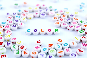 Word color formed by plastic beads