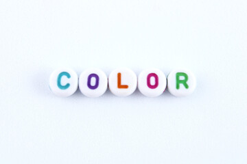 Word color formed by plastic beads