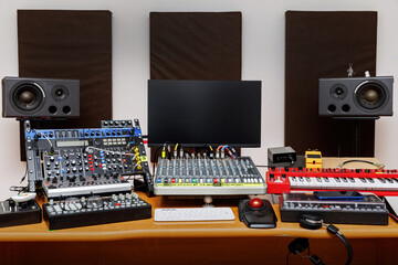 Sound engineer equipment set-up at a music production studio. - obrazy, fototapety, plakaty