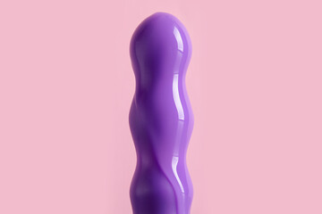 Vibrator with lubricant on pink background