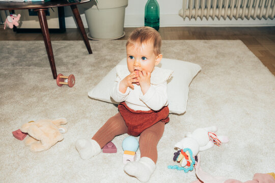 Naklejki Baby playing at home 