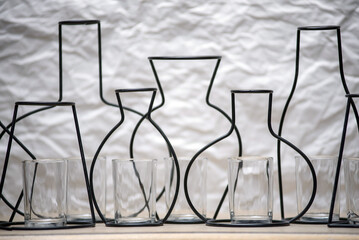 Empty jugs, silhouettes and glasses