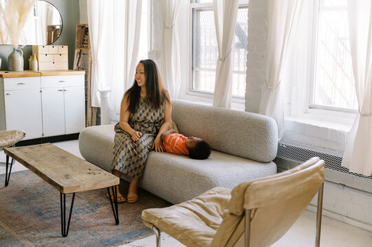 mom at home with her child in living room