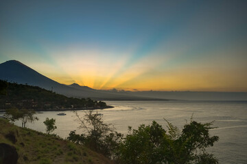 sunset at amed beach, view agung mount. bali