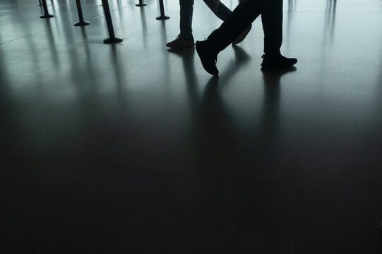two people walking legs closeup