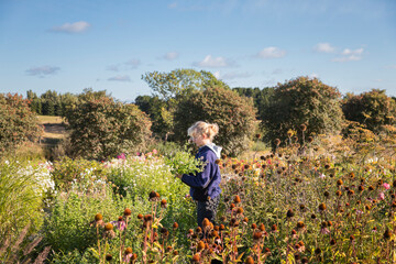 Woman holding flower bouquet outdoors