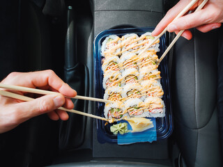 Couple Eating Sushi in Car