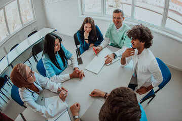 Top view of a group of multiethnic medical professionals including doctors, surgeons, and nurses...