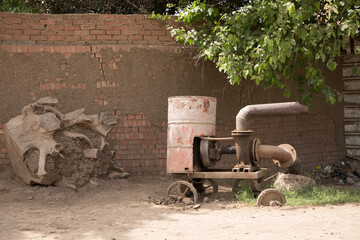 A pump for irrigating the fields with water from the Nile in a Traditional Egyptian village near Cairo, Egypt