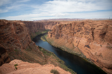 Powell Lake river flowing through a red rocky canyon in Arizona