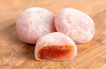 Pink Passion Fruit Boba Mochi on a Wood Background