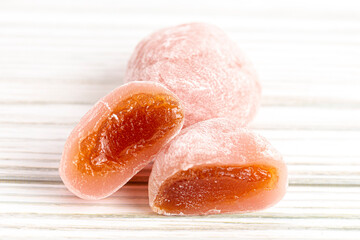 Pink Passion Fruit Boba Mochi on a Wood Background