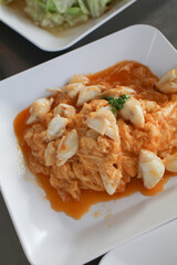 Stir Fried crab meat with curry powder. ฆeafood cuisine and food travel. Thai food thai cuisine food on dish, Copy space.