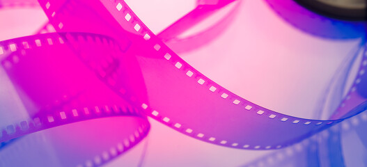 multicolored abstract background with film strip.film festival filmmaking movie announcement concept - obrazy, fototapety, plakaty