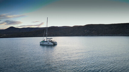 Fototapeta premium Catamaran Anchored in Cove for the Evening