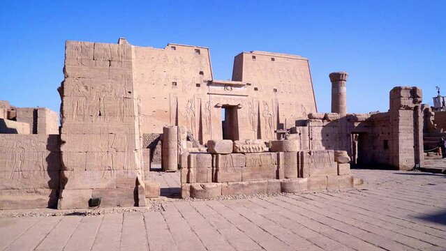 EDFU EGYPT. TRUCK RIGHT. Panoramic view of Edfu Temple. This temple is dedicated to the falcon god Horus. On the walls of the temple there are different carved reliefs.