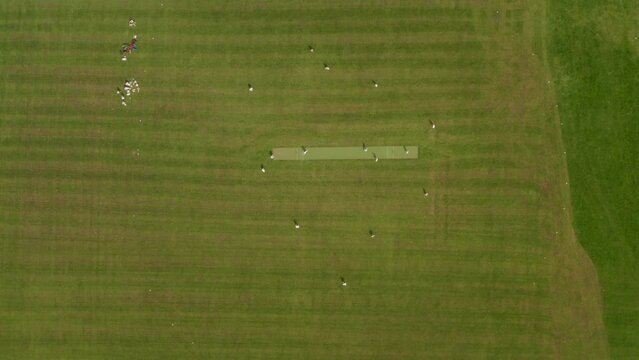 Top down aerial shot over amateur cricket game