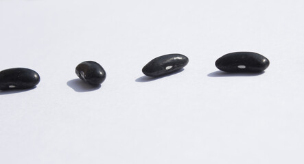 Side by side Black beans on white background